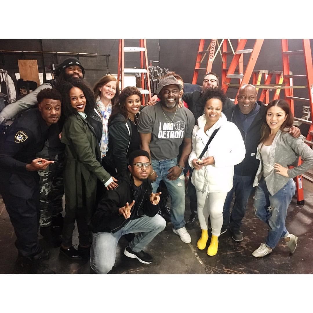 Dion Fearon and John Singleton on set with the cast and crew of REBEL
